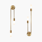 Modern gold wall sconces with sleek, minimalist design and frosted glass shades, perfect for contemporary home lighting and interior decor.