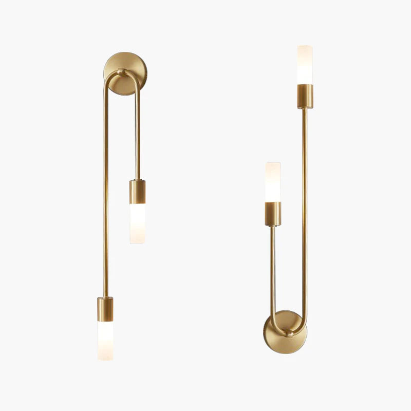 Modern gold wall sconces with sleek, minimalist design and frosted glass shades, perfect for contemporary home lighting and interior decor.