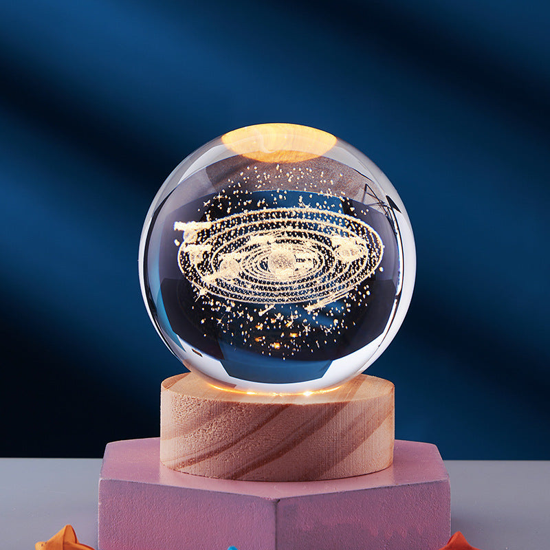 3D galaxy crystal ball on wooden base, illuminated with LED lights, showcasing intricate star patterns. Perfect for home decor and gifts.