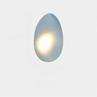 Modern egg-shaped wall sconce with soft ambient LED light, minimalist design, perfect for contemporary home decor and energy-efficient lighting solutions.