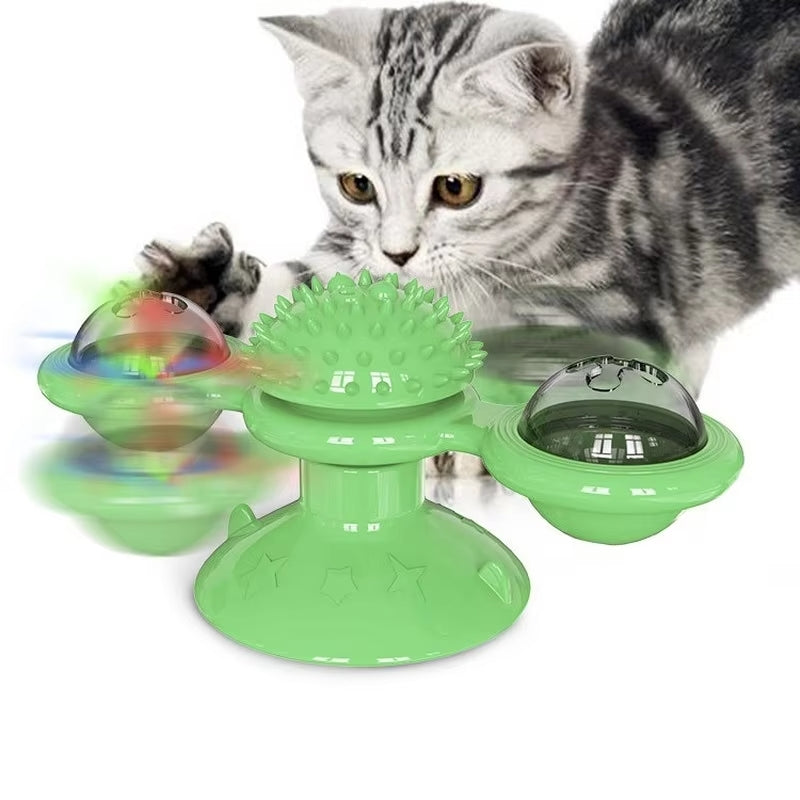 Green interactive cat toy with spinning balls and textured center, designed for playful kittens. Ideal for pet entertainment and exercise.