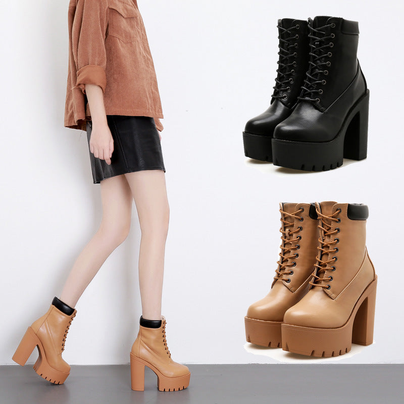 Women's platform ankle boots in black and tan, featuring chunky high heels and lace-up design, paired with a stylish outfit for a trendy look.