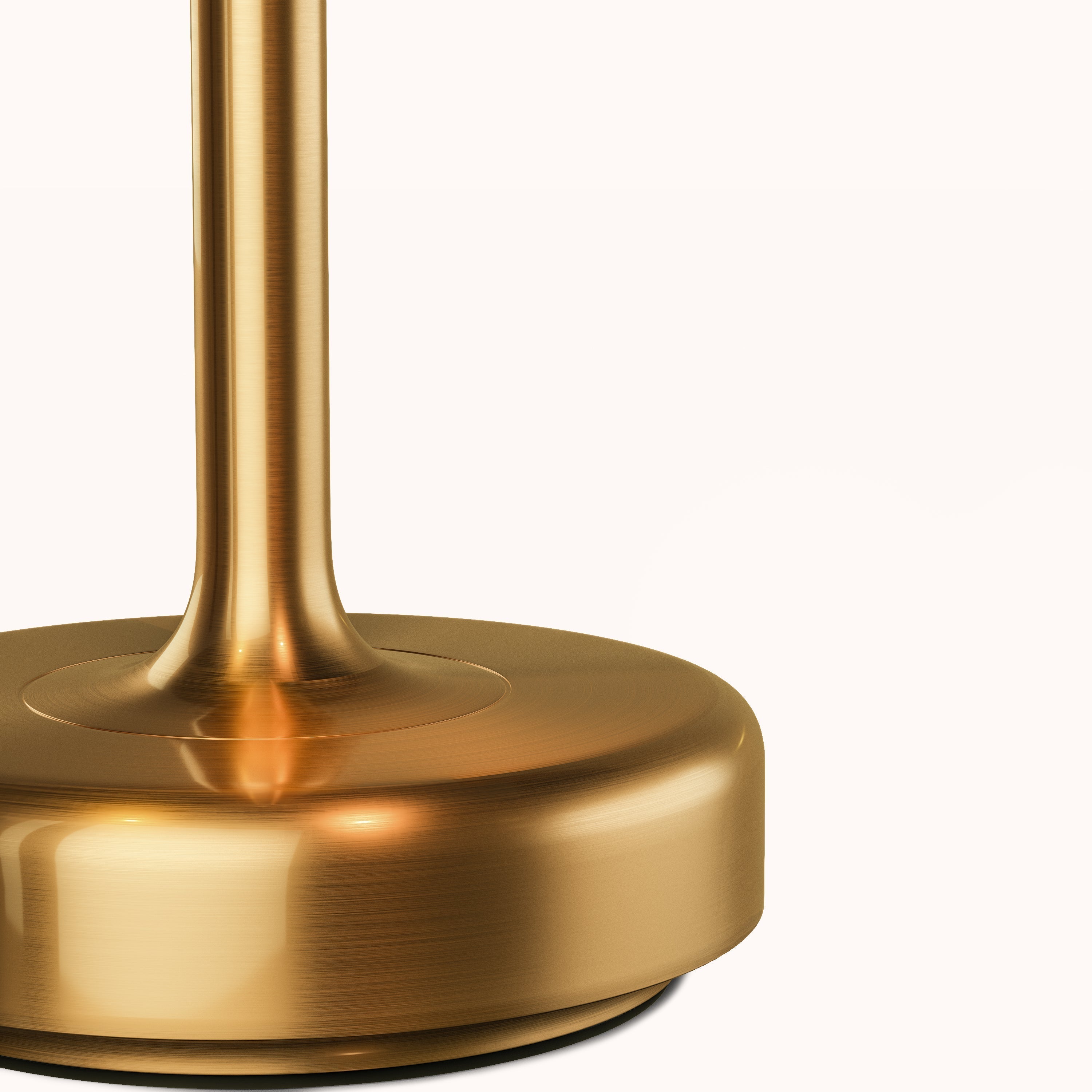 Close-up of a modern brass lamp base with a sleek, polished finish. Ideal for contemporary home decor, lighting design, and interior styling.