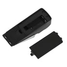 Black plastic battery compartment cover for electronic device, shown detached. Ideal replacement part, durable and easy to install.