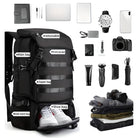 Versatile black travel backpack with labeled compartments, including shoe bag and front pocket, surrounded by travel essentials like camera and laptop.