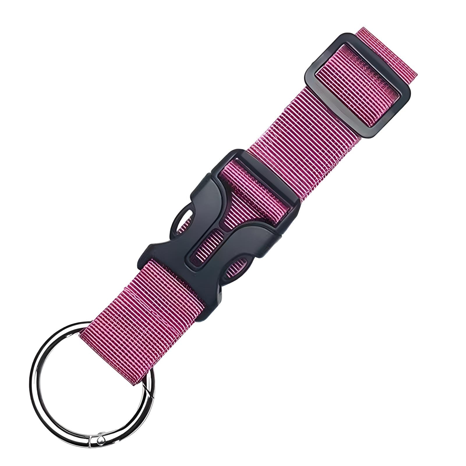 Pink nylon keychain wrist strap with black plastic buckle and metal keyring. Durable and adjustable, ideal for keys and accessories.