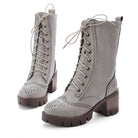 Women's gray lace-up ankle boots with chunky heels, brogue detailing, and rugged soles. Stylish, durable footwear for fall and winter fashion.