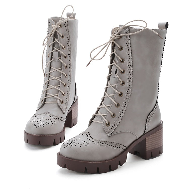 Women's gray lace-up ankle boots with chunky heels, brogue detailing, and rugged soles. Stylish, durable footwear for fall and winter fashion.