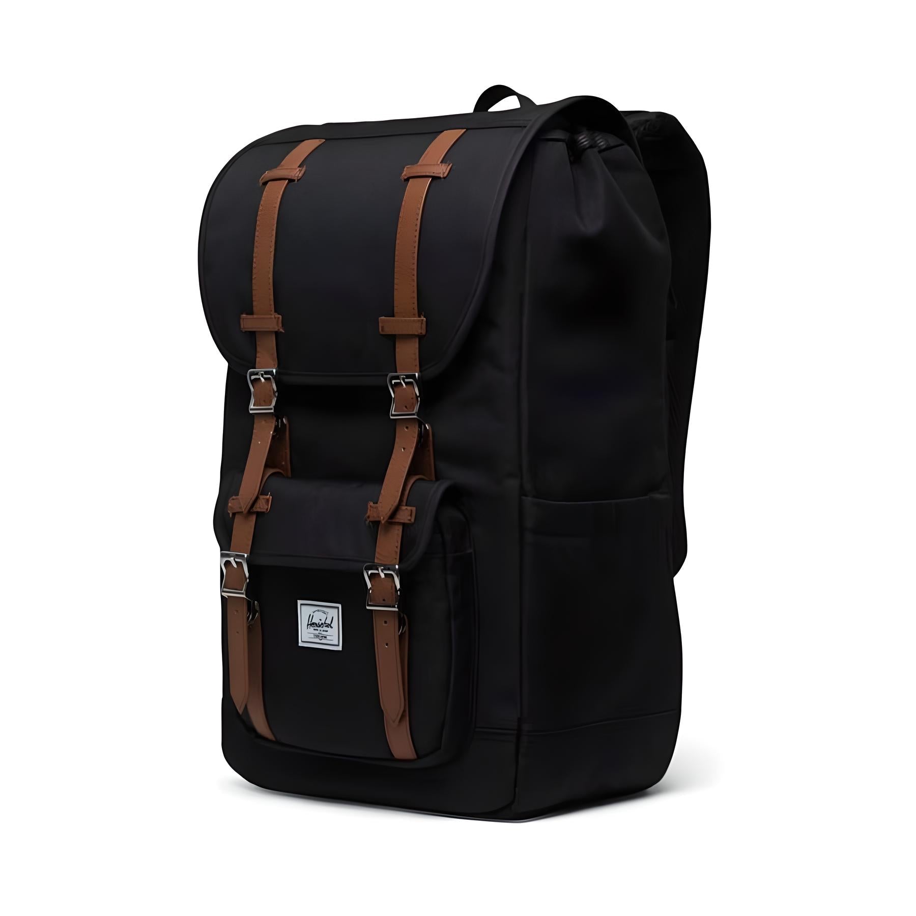 Black backpack with brown leather straps, front pocket, and logo patch. Stylish, durable, and spacious, perfect for travel or school.