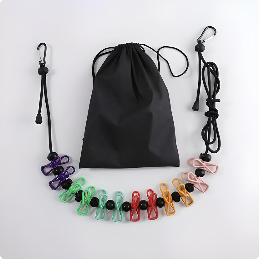 Colorful travel clothesline with clips and black drawstring bag, featuring adjustable hooks. Ideal for camping, hiking, and outdoor drying needs.