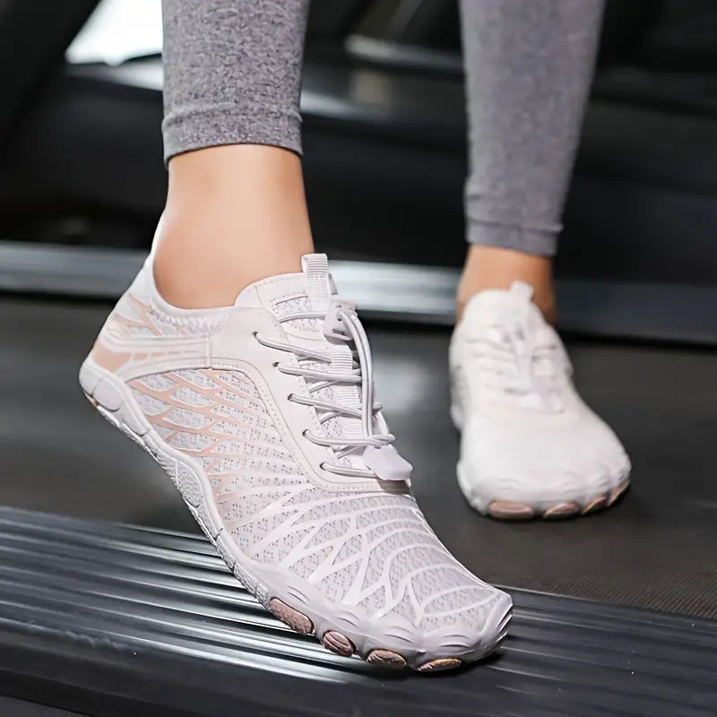 White minimalist running shoes on treadmill, featuring breathable mesh design and lightweight sole. Perfect for fitness, exercise, and active lifestyle.