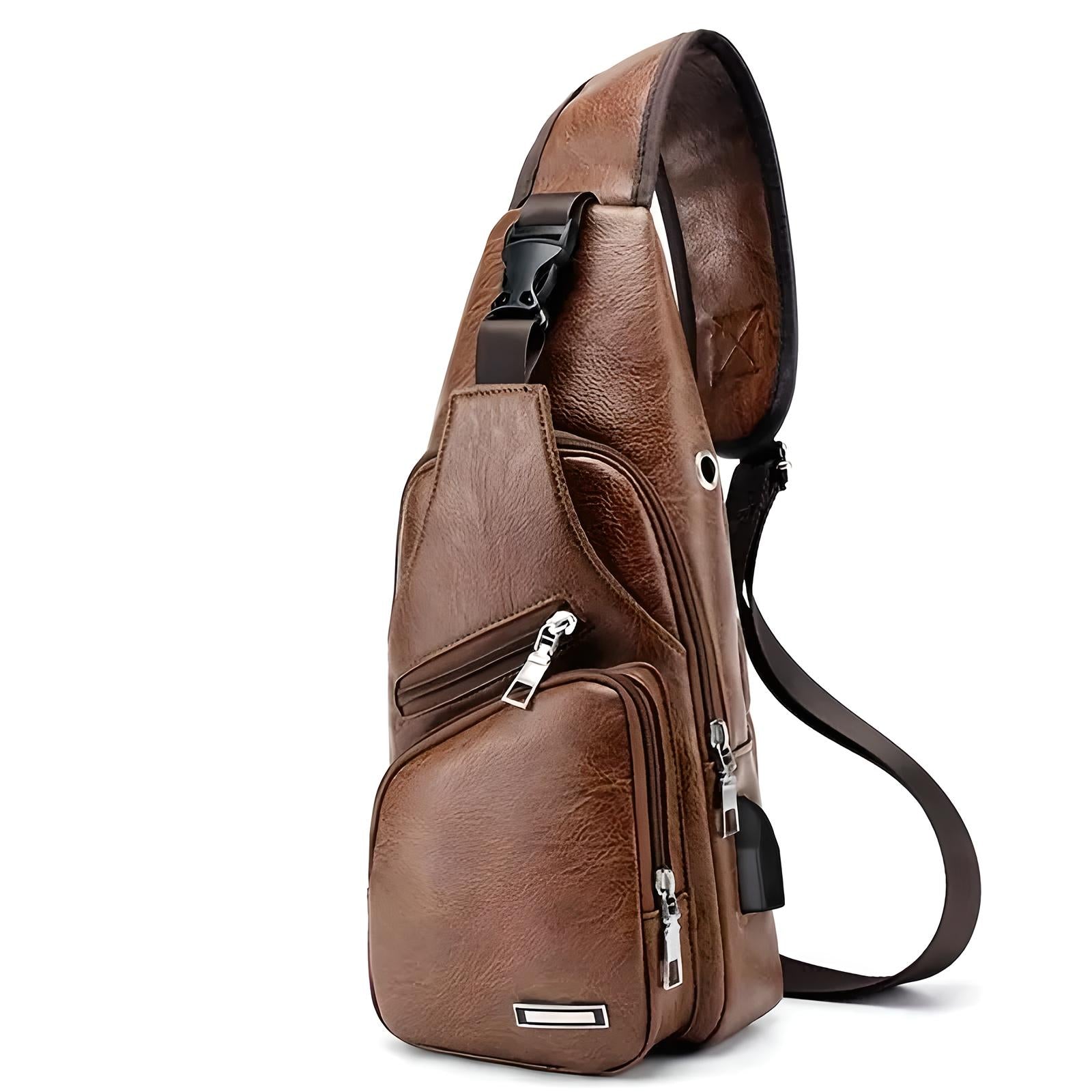 Brown leather sling bag with multiple zippered compartments, adjustable strap, and sleek design. Perfect for travel, casual outings, and daily use.