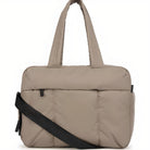 Beige padded laptop bag with black adjustable shoulder strap, multiple compartments, and durable handles. Ideal for travel and work. Stylish and functional.