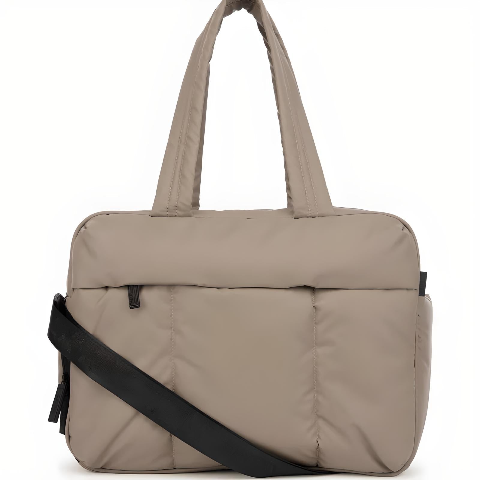 Beige padded laptop bag with black adjustable shoulder strap, multiple compartments, and durable handles. Ideal for travel and work. Stylish and functional.