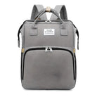 Gray backpack with front zipper pocket, top handles, and adjustable shoulder straps. Features "You Are My Sunshine" label. Ideal for travel or school.