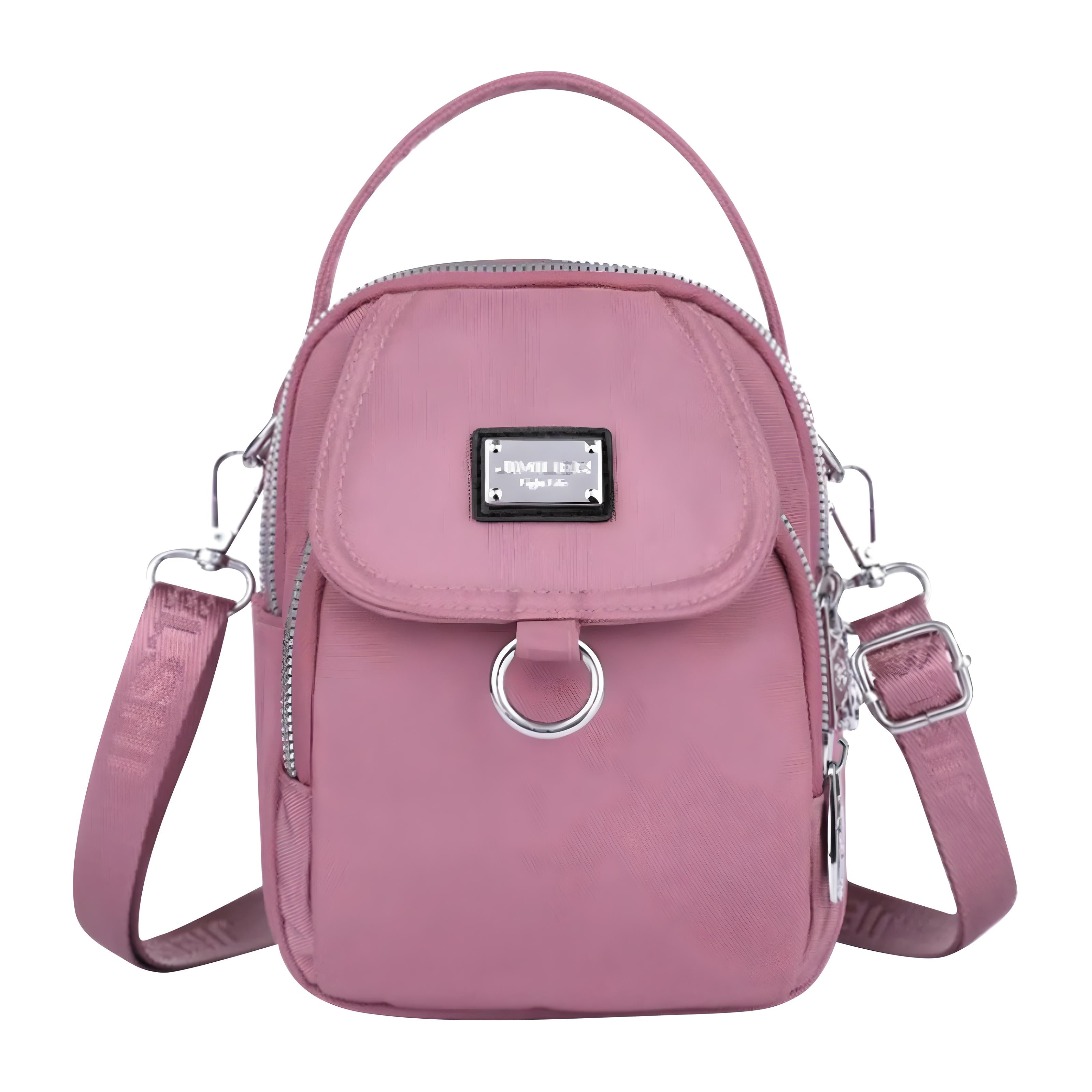 Pink crossbody bag with adjustable strap, front zipper pocket, and metal ring detail. Stylish women's handbag for casual and travel use.