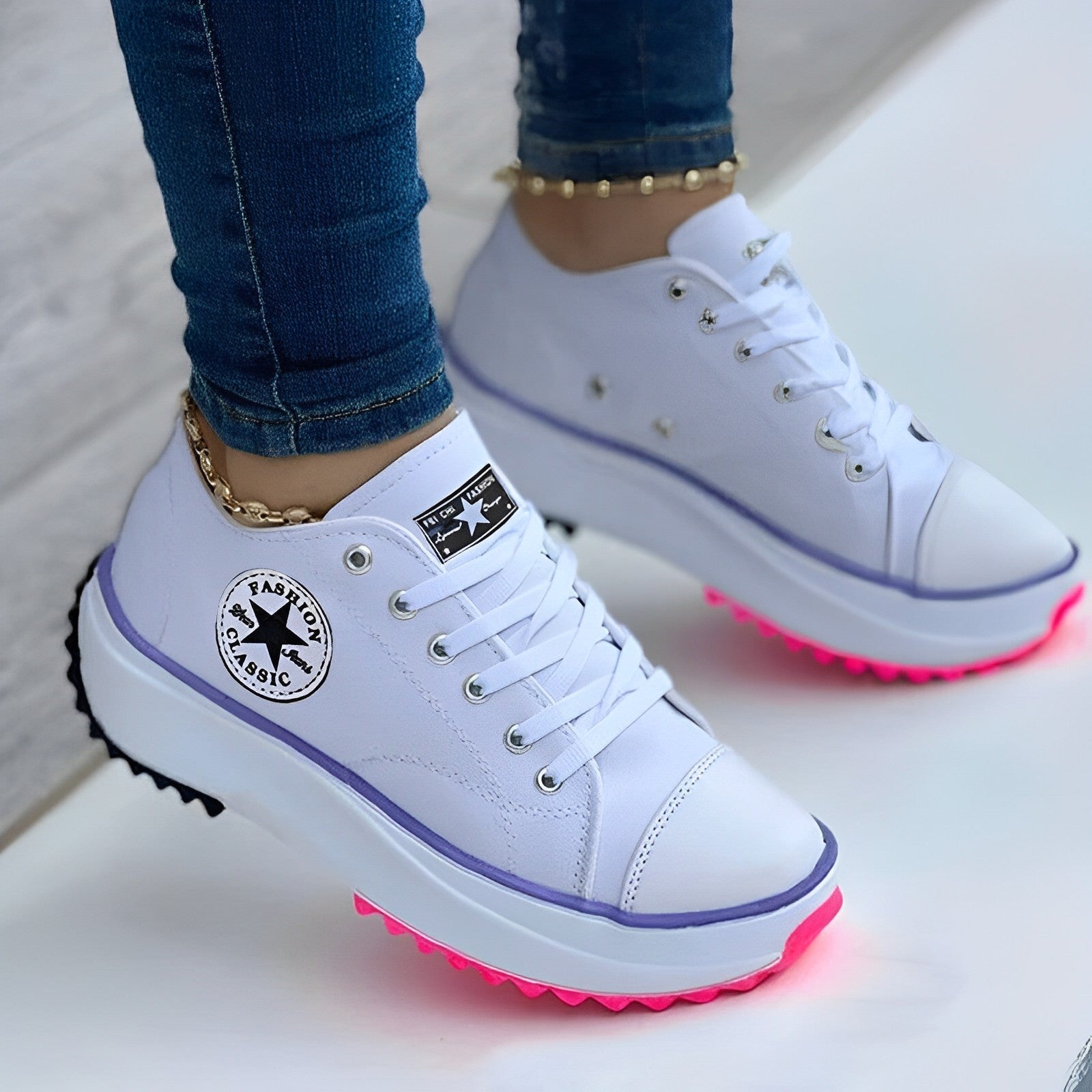 White platform sneakers with LED pink soles, star logo, and gold anklet detail. Trendy women's fashion footwear, casual style, comfortable design.