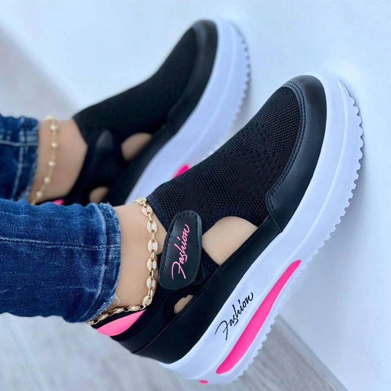 Women's black platform sneakers with breathable mesh, round toe, and pink accents. Casual running shoes for comfort and style. Fashion footwear.