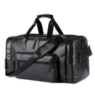 Sleek black leather duffel bag with multiple zippered compartments and adjustable shoulder strap, perfect for travel or gym use.