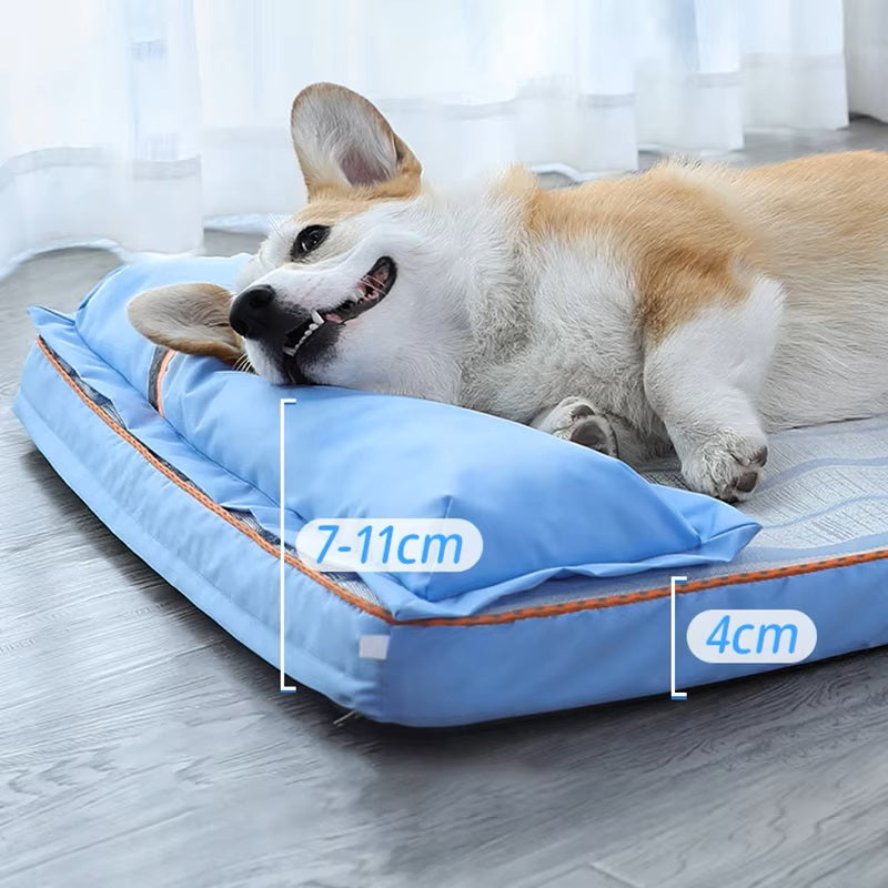 Corgi lying on a blue orthopedic dog bed with pillow, dimensions 7-11cm and 4cm, on a wooden floor. Comfortable pet bedding, dog relaxation.