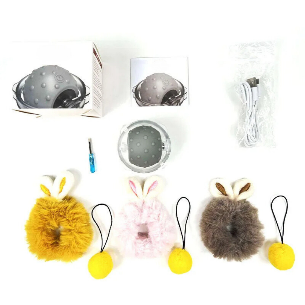 Cat toy set with interactive ball, USB charging cable, screwdriver, and four plush covers in yellow, pink, gray, and brown with bunny ears.