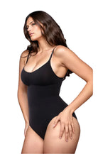 Woman wearing a black seamless bodysuit with spaghetti straps, showcasing a sleek and comfortable fit. Fashionable women's shapewear, body confidence.