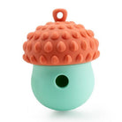 Silicone acorn-shaped baby teether in orange and mint green, featuring a textured surface for soothing gums. Safe, BPA-free infant teething toy.