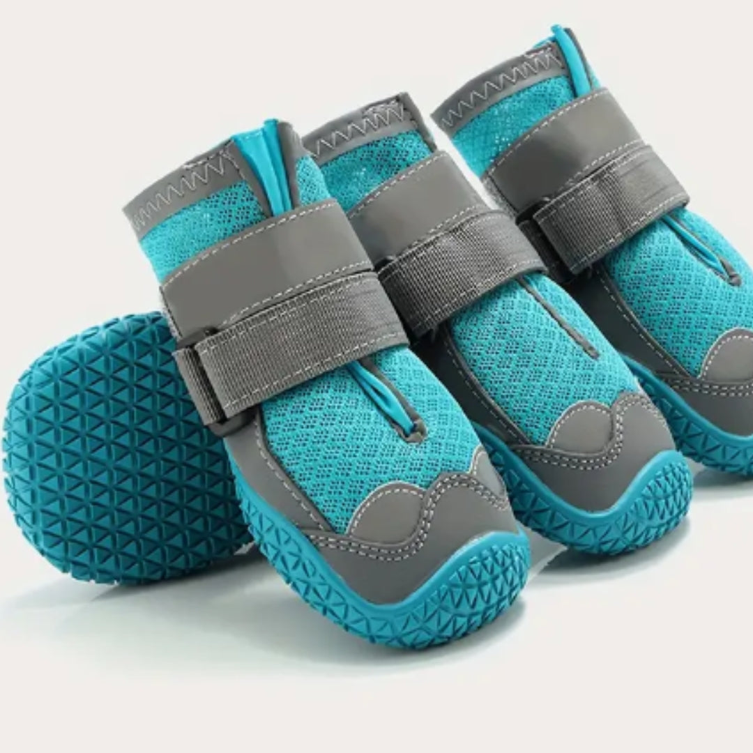 Turquoise and gray dog boots with adjustable straps, non-slip soles, and breathable mesh design. Ideal for pet paw protection and outdoor activities.