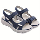 Navy blue orthopedic sandals with adjustable Velcro straps, cushioned insoles, and non-slip soles for comfort and support. Ideal for walking.