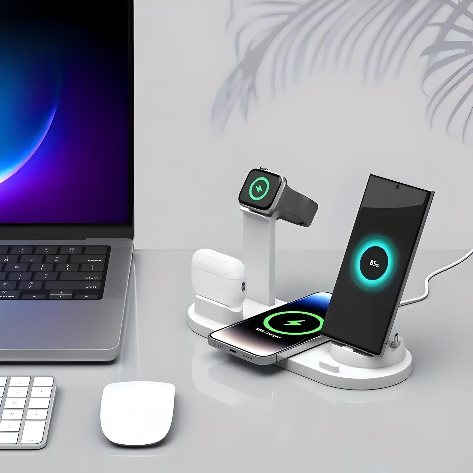 Multi-device wireless charging station with smartphone, smartwatch, and earbuds on a sleek desk setup, featuring a laptop and mouse.