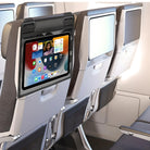 Airplane economy class seats with built-in tablet screens displaying apps, modern in-flight entertainment system, ergonomic design, travel technology.