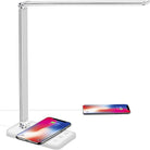 LED desk lamp with wireless charging pad, USB port, and adjustable arm, ideal for office or study, compatible with smartphones and tablets.