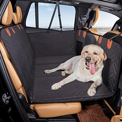 Dog sitting on a black quilted car seat cover in the backseat of a vehicle, designed for pet protection and comfort during travel.