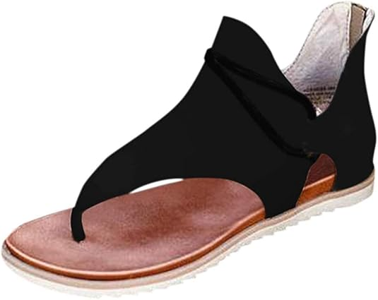 Black gladiator sandal with open toe design, brown cushioned footbed, and white rubber sole. Stylish women's summer footwear, casual fashion.