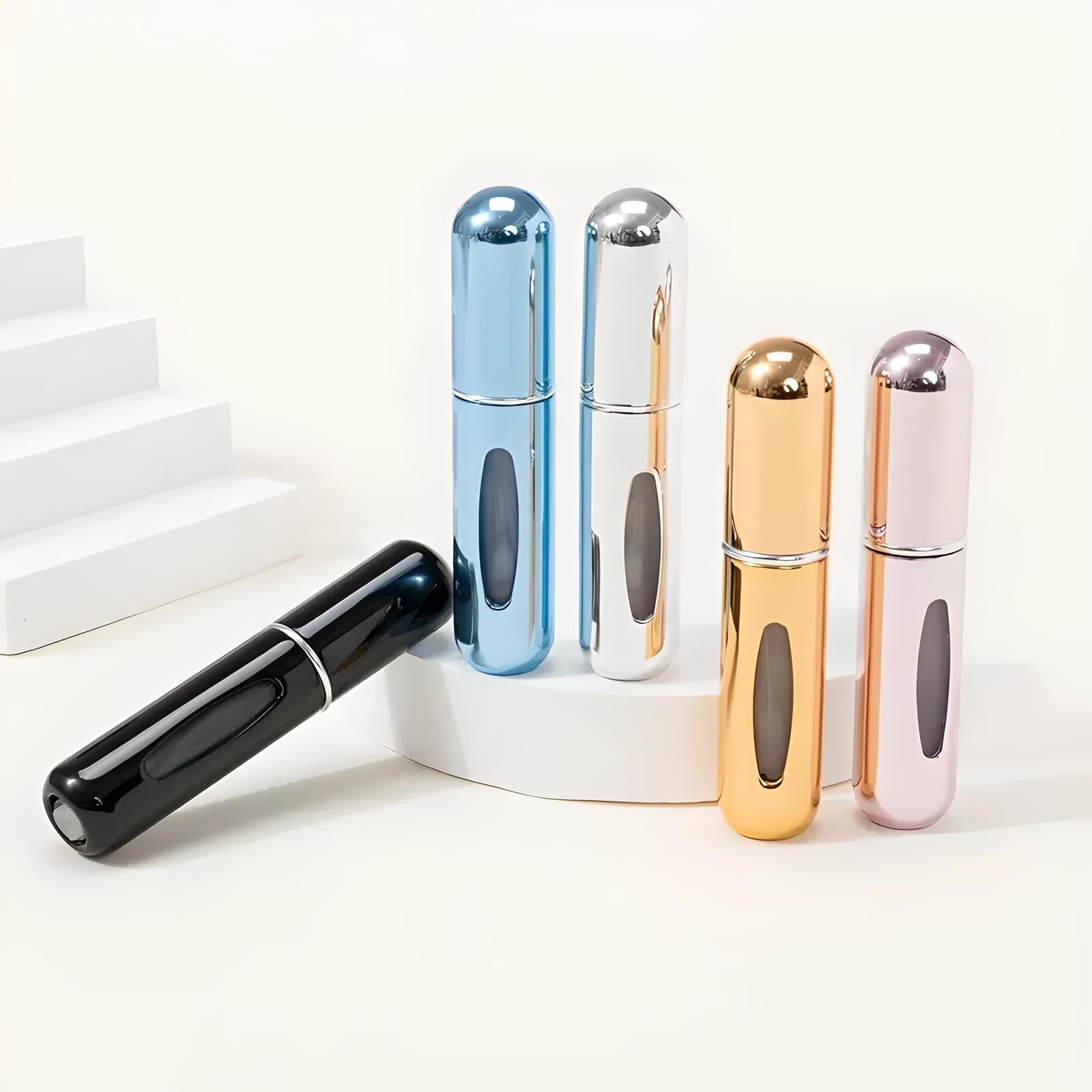 Portable perfume atomizers in metallic colors: black, blue, silver, gold, and rose gold. Ideal for travel, refillable, sleek design.