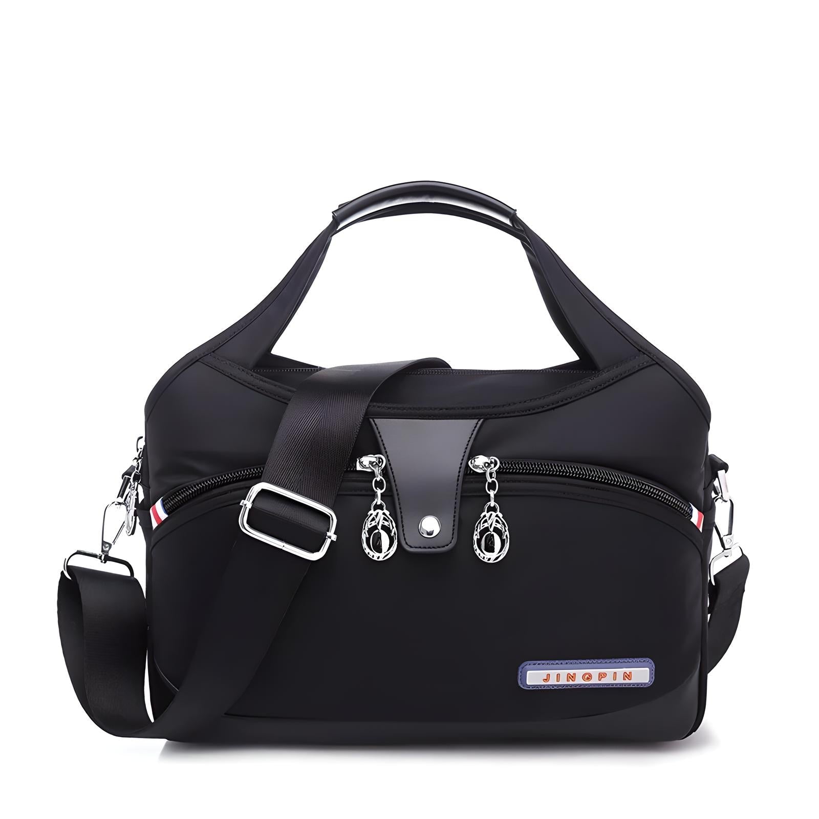 Black waterproof nylon shoulder bag with adjustable strap, multiple zippered compartments, and silver hardware. Ideal for travel and daily use.