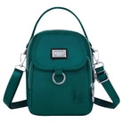 Teal crossbody bag with adjustable strap, front flap, and silver hardware. Stylish and functional accessory for women. Perfect for everyday use.