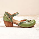 Green leather Mary Jane shoe with wooden block heel, ankle strap, and cutout design. Perfect for vintage fashion enthusiasts and comfortable footwear seekers.