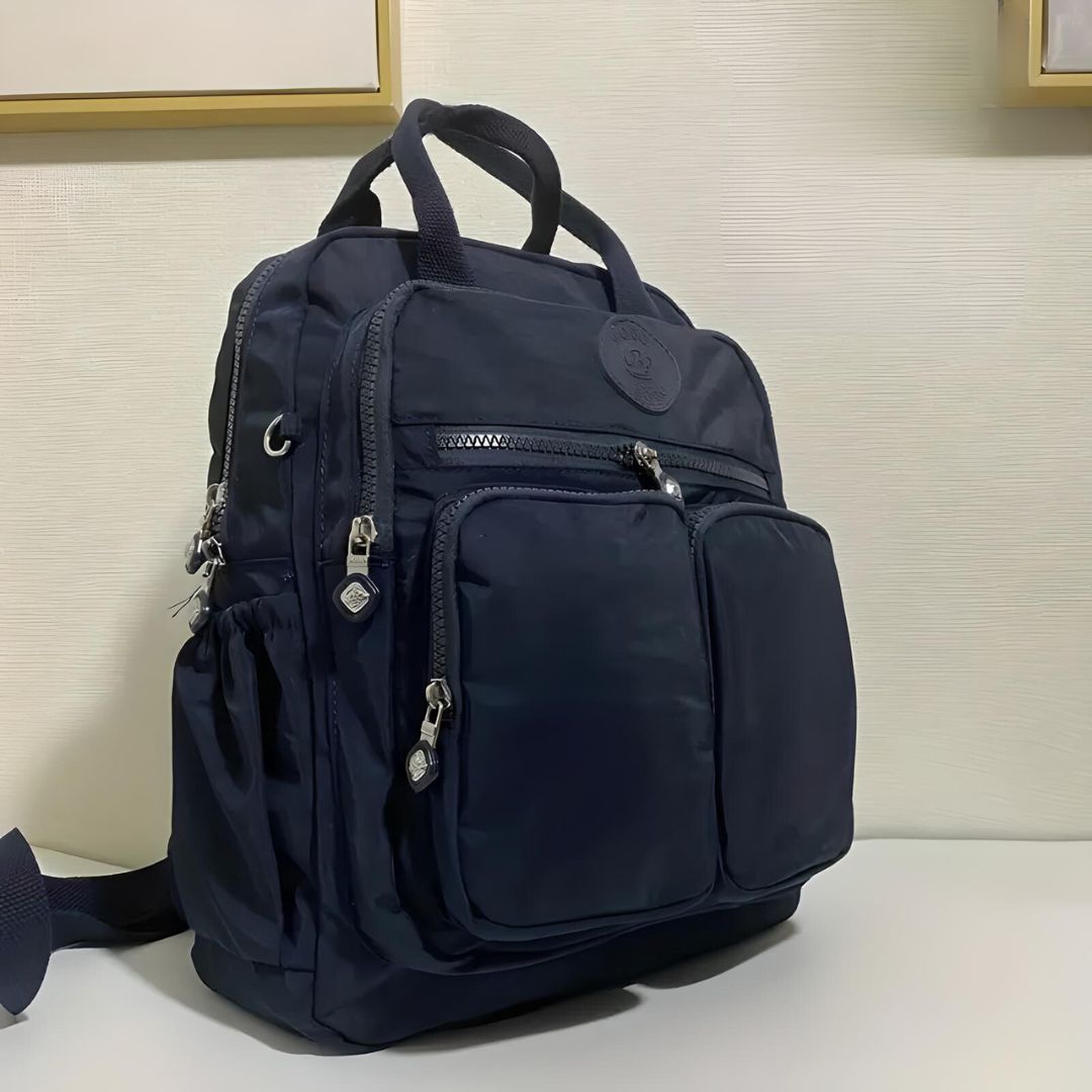 Dark blue multi-pocket backpack with zippers, durable fabric, and adjustable straps, ideal for travel, school, or work. Stylish and functional design.