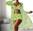 Woman modeling green paisley print two-piece swimsuit with matching cover-up, showcasing trendy beachwear fashion. Lightweight, comfortable summer outfit.