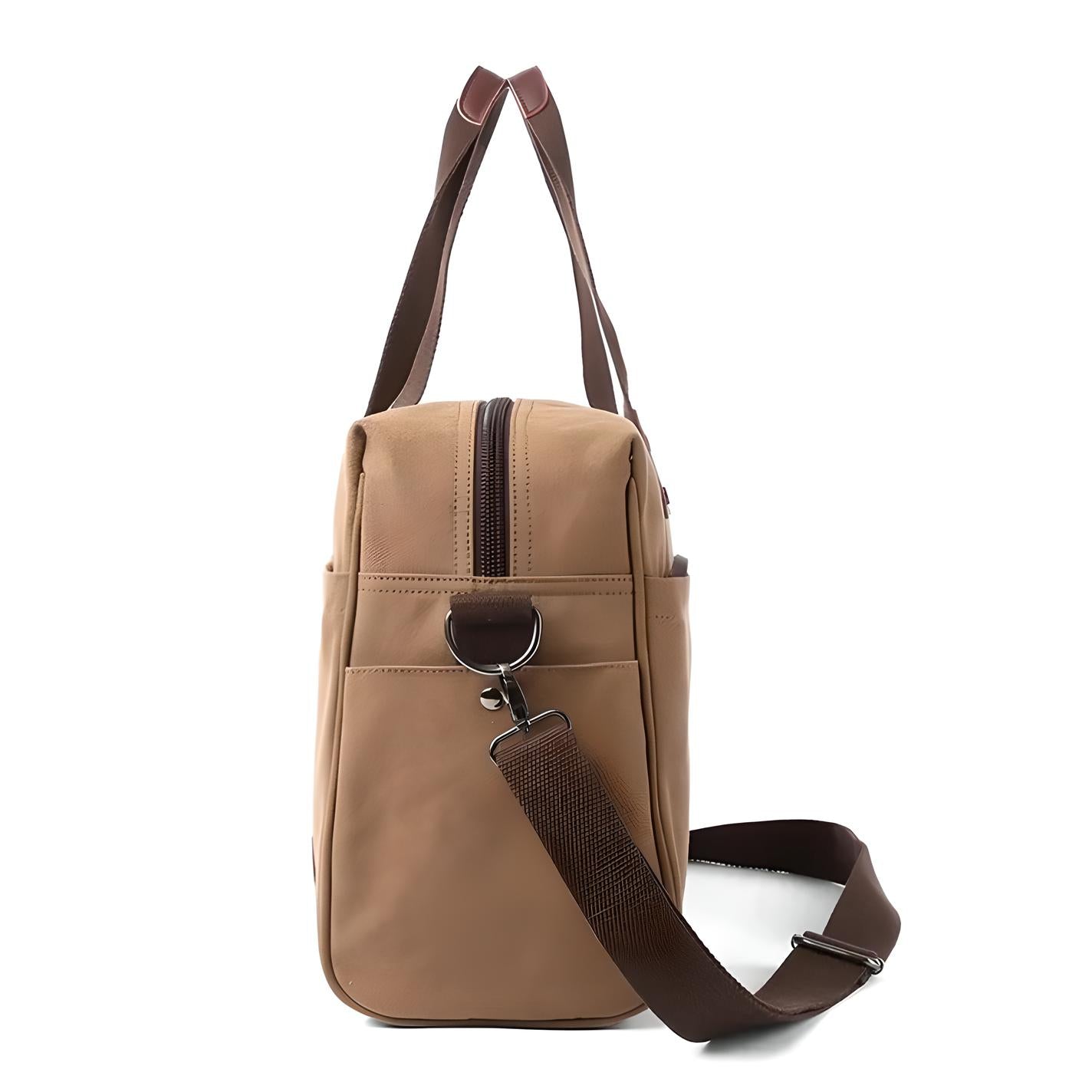 Side view of a stylish tan leather duffel bag with brown adjustable shoulder strap, featuring a zippered top and metal ring accents. Perfect for travel.