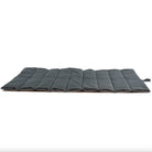 Foldable waterproof outdoor dog mat, durable black design, travel-friendly pet accessory.
