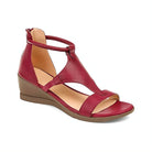 Red leather wedge sandal with ankle strap, open toe design, and cushioned footbed. Perfect for summer fashion and casual wear. Women's footwear.