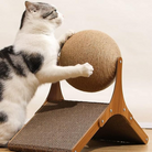 Cat playing with a sisal ball on a wooden scratching post ramp, perfect for pet exercise and claw maintenance. Ideal cat furniture for indoor play.