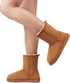 Women's classic brown suede winter boots with plush lining, mid-calf height, and durable sole. Cozy footwear for cold weather. Fashionable and warm.