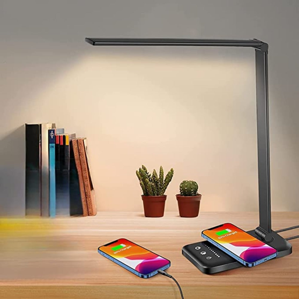 Sleek LED desk lamp with wireless charging pad, USB port, and adjustable arm on wooden desk; ideal for modern home office lighting solutions.