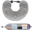 Gray travel neck pillow with storage compartment, featuring a soft, plush design. Ideal for travel comfort and organization. Perfect for frequent flyers.