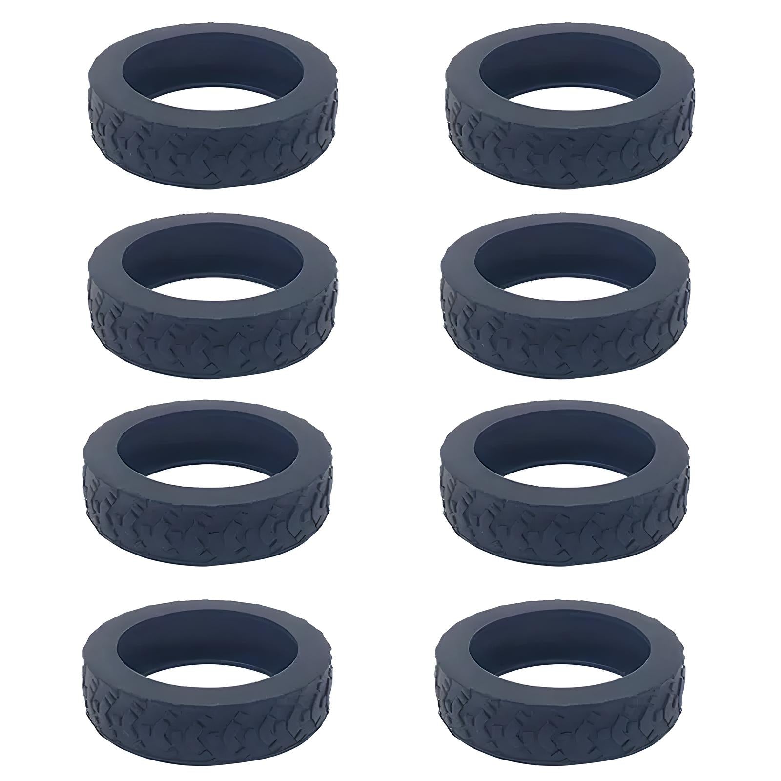 Eight black rubber tire bands with textured tread pattern, arranged in two vertical rows. Ideal for toy cars, model vehicles, or crafting projects.