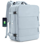 Light blue travel backpack with USB charging port, multiple compartments, and adjustable straps. Ideal for tech-savvy travelers and commuters.