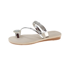 Silver women's sandal with rhinestone straps and flower embellishment on beige sole, perfect for summer fashion and casual wear.